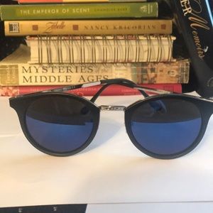 Retro sunglasses with black frames w/ blue lens